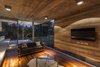 Modern home with Living Room, Sofa, Accent Lighting, Coffee Tables, Medium Hardwood Floor, and Concrete Floor. Torcuato House Pavilion - Besonías Almeida arquitectos Photo 15 of Torcuato House Pavilion