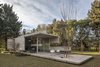 Modern home with Outdoor, Back Yard, Trees, Gardens, Shrubs, Grass, and Concrete Patio, Porch, Deck. Torcuato House Pavilion - Besonías Almeida arquitectos Photo 2 of Torcuato House Pavilion