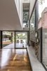 Modern home with Living Room, Wood Burning Fireplace, Medium Hardwood Floor, and Accent Lighting. Aranzazu House - Besonías Almeida arquitectos Photo 10 of Aranzazu House