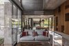 Modern home with Living Room, Sofa, Coffee Tables, and Medium Hardwood Floor. Aranzazu House - Besonías Almeida arquitectos Photo 12 of Aranzazu House