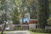 Modern home with Exterior, House, Wood Siding Material, Concrete Siding Material, and Glass Siding Material. Aranzazu House - Besonías Almeida arquitectos Photo 5 of Aranzazu House