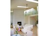 Modern home with Living Room, Chair, Sofa, Coffee Tables, Ceiling Lighting, Light Hardwood Floor, and Two-Sided Fireplace. living room Photo 7 of Leesburg House
