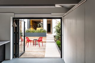 Also featuring large bifold doors, the home office located in the back of the property has been revamped to read as a mirror of the main house.