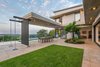 Modern home with Outdoor, Swimming Pools, Tubs, Shower, Grass, Concrete Fences, Wall, Landscape Lighting, Back Yard, Stone Patio, Porch, Deck, and Vertical Fences, Wall. The total floor area of the house is 590m2 with the ground floor accommodating the main open plan living areas, guest bedroom and study. Photo of City View House
