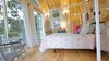 Modern home with Living Room, Chair, Ceiling Lighting, Table Lighting, and Wall Lighting. Glass French Doors Open Into Living Space Photo 7 of Hawaiian Treehouse