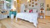 Modern home with Bedroom, Medium Hardwood Floor, Table Lighting, Chair, Bed, Wall Lighting, Night Stands, and Storage. Bedroom/living area Photo of Romantic Tree Cottage in the Hawaiian Rainforest