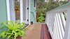 Modern home with Outdoor, Decking Patio, Porch, Deck, Wood Patio, Porch, Deck, and Small Patio, Porch, Deck. Lanai looking out onto the native Ohia and Hapu'u trees. Photo 10 of Romantic Tree Cottage in the Hawaiian Rainforest