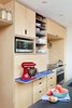 Modern home with Kitchen, Microwave, Wall Oven, Engineered Quartz Counter, Wood Cabinet, Laminate Cabinet, Ceramic Tile Backsplashe, and Recessed Lighting. pull-out laminate work surface at appliance garage Photo 2 of K Street Addition