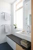 Modern home with Bath Room, Engineered Quartz Counter, Ceramic Tile Floor, Wall Mount Sink, Open Shower, Recessed Lighting, and Ceramic Tile Wall. master bath looking toward curbless shower Photo 8 of K Street Addition