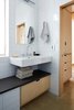 Modern home with Bath Room, Engineered Quartz Counter, Concrete Floor, Wall Mount Sink, Open Shower, Recessed Lighting, Wall Lighting, and Ceramic Tile Wall. master bath looking toward closet Photo 9 of K Street Addition