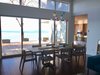 Modern home with Dining Room, Table, Chair, Pendant Lighting, and Bamboo Floor. Breeze Space with Kitchen on the right Photo 17 of Cortes Island Custom Blu Prefab