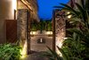 Modern home with Exterior, Concrete Siding Material, Green Roof Material, and Beach House Building Type. Enter Esqina Del Cielo into a private courtyard brought to life by the bubbling fountain, indigenous materials and a hint at the elegant craftsmanship to follow. Photo 2 of Esquina Del Cielo