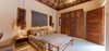 Each palapa roofed guest casita retains the simple, elegant approach of the main villa. Photo 17 of Esquina Del Cielo modern home