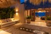 Modern home with Outdoor, Stone Patio, Porch, Deck, and Landscape Lighting. The grand palapa is framed to catch the majestic views, day or night. The open air villa relies on simple predominantly on pleasing wooden louvers to moderate the the light, temperature and breezes. Photo 3 of Esquina Del Cielo