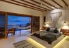 Like the rest of the villa, the master is adorned with clean modern lines with organic, local materials, and a simple, natural palette, letting the views and nature take the lead. Photo 12 of Esquina Del Cielo modern home