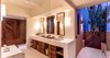 With the open air, ocean view outdoor shower, the master bath features his and her sinks and amazing locally crafted wood cabinetry and details thoughout. Photo 13 of Esquina Del Cielo modern home