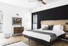 Modern home with Bedroom, Bed, Dresser, Wall Lighting, Pendant Lighting, and Medium Hardwood Floor. The master bedroom. Photo 14 of Nir Am House