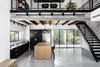 Modern home with Kitchen, Refrigerator, Cooktops, Metal Counter, Colorful Cabinet, Concrete Floor, Ceramic Tile Backsplashe, Ceiling Lighting, and Undermount Sink. Both floors. Photo 12 of Nir Am House
