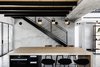 Modern home with Dining Room, Bar, Stools, Ceiling Lighting, Pendant Lighting, and Concrete Floor. Metal staircase on concrete wall. Hand made lighting fixtures by Asaf Weinbroom. Photo 8 of Nir Am House