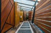Modern home with Outdoor, Large Pools, Tubs, Shower, Wood Fences, Wall, Stone Patio, Porch, Deck, Hanging Lighting, Garden, and Horizontal Fences, Wall. Pool Bathroom Photo 9 of CASA LOBO