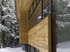 Modern home with Exterior, House, Metal Roof Material, Wood Siding Material, Brick Siding Material, and Flat RoofLine. facade detail Photo 7 of Eels Lake Cottage