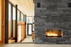Interior palette: slate fireplace, Douglas fir ceilings, black accents, glass Photo of Eels Lake Cottage modern home