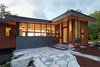 Modern home with Exterior, House, Beach House Building Type, Metal Roof Material, Wood Siding Material, Flat RoofLine, and Butterfly RoofLine. Entrance doorway Photo 2 of Stanley Bay House