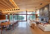 Modern home with Living Room, Concrete Floor, Gas Burning Fireplace, Recessed Lighting, Chair, Sofa, and Coffee Tables. waterside view Photo 9 of Stanley Bay House