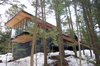 Modern home with Exterior, Beach House Building Type, House, Metal Roof Material, Wood Siding Material, Glass Siding Material, and Flat RoofLine. Glass box cantilever and large Douglas fir overhangs Photo of Tucker Lake Cottage