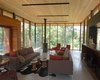 Modern home with Living Room, Ceiling Lighting, Accent Lighting, Sofa, Chair, Concrete Floor, and Gas Burning Fireplace. interior living room Photo 9 of Tucker Lake Cottage