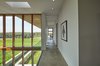 Modern home with Hallway and Concrete Floor. Hallway and double-height stair Photo 14 of Stouffville Residence