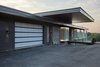 Modern home with Exterior, Wood Siding Material, Metal Roof Material, Glass Siding Material, Brick Siding Material, House Building Type, and Flat RoofLine. Large overhang over main entrance Photo 20 of Stouffville Residence