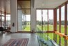 Modern home with Hallway and Concrete Floor. Hall and main feature stair with concrete-filled steel treads Photo 13 of Stouffville Residence