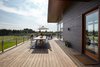 Modern home with Exterior, Metal Roof Material, House Building Type, Wood Siding Material, and Flat RoofLine. Ipe deck patio Photo 19 of Stouffville Residence