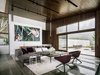 Modern home with Living Room, Sofa, Ceiling Lighting, Chair, Limestone Floor, Coffee Tables, and Wall Lighting. Living room Photo 9 of Fall House