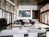 Modern home with Living Room, Limestone Floor, Sofa, Ceiling Lighting, Chair, and Coffee Tables. Living room Photo 13 of Fall House