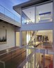 Modern home with Exterior, Flat RoofLine, Metal Siding Material, Metal Roof Material, Glass Siding Material, and House. Living area at night time Photo 7 of 1532 House