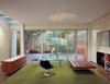 Modern home with Living Room, Concrete Floor, Accent Lighting, Bench, Coffee Tables, Chair, Standard Layout Fireplace, and Ceiling Lighting. Living area Photo 8 of 1532 House