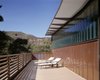 Modern home with Exterior, Glass Siding Material, House Building Type, Metal Siding Material, Butterfly RoofLine, and Metal Roof Material. Spacious deck Photo 7 of Jackson Family Retreat