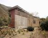 Modern home with Exterior, House Building Type, Butterfly RoofLine, Metal Roof Material, Wood Siding Material, Glass Siding Material, and Metal Siding Material. The house and its surrounding Photo 4 of Jackson Family Retreat
