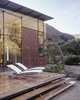 Modern home with Exterior, Glass Siding Material, House Building Type, Butterfly RoofLine, Metal Siding Material, and Metal Roof Material. Terrace Photo 5 of Jackson Family Retreat