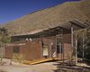 Modern home with Exterior, Metal Roof Material, Butterfly RoofLine, Wood Siding Material, Metal Siding Material, House Building Type, and Glass Siding Material. Front facade of the house Photo 10 of Jackson Family Retreat