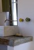 Modern home with Bath Room, Stone Counter, and Concrete Wall. interior marble wash basin Photo 10 of the camping house