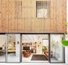 Modern home with Office, Desk, Bookcase, Craft Room Room Type, Shelves, Study Room Type, Lamps, Concrete Floor, Storage, and Chair. Home Studio conected to Patio Photo of Conversion of a ground-floor publisher’s warehouse into a residence and atelier for an artist-architect couple
