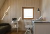 Modern home with Bedroom, Medium Hardwood Floor, Chair, and Track Lighting. writer's bedroom Photo 13 of House by the sea by AB CHVOYA