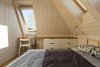 Modern home with Bedroom, Medium Hardwood Floor, Bed, and Track Lighting. small bedroom Photo 9 of House by the sea by AB CHVOYA