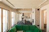Modern home with Dining Room, Standard Layout Fireplace, Table, Track Lighting, Slate Floor, and Wood Burning Fireplace. kitchen\dining room Photo 7 of House by the sea by AB CHVOYA