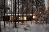 Modern home with Exterior, Shed RoofLine, Wood Siding Material, Metal Roof Material, and House Building Type. House is located in a pine forest Photo of House for two artists by AB CHVOYA
