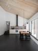 Modern home with Dining Room, Table, Ceramic Tile Floor, and Track Lighting. kitchen Photo 7 of House for two artists by AB CHVOYA