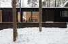 Modern home with Exterior, Shed RoofLine, House Building Type, Wood Siding Material, and Metal Roof Material. Living room big window with shutters Photo 5 of House for two artists by AB CHVOYA